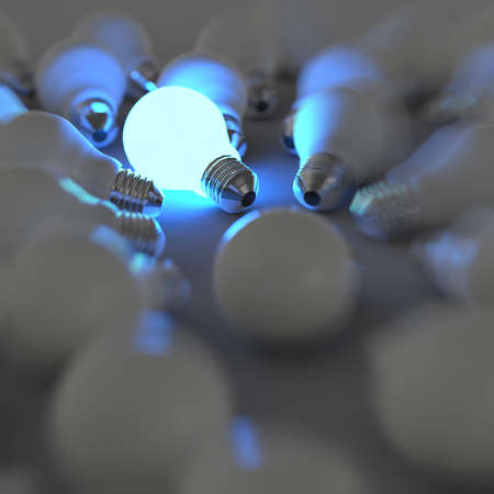 3d growing light bulb standing out from the unlit incandescent bulbs as leadership conceptの写真素材