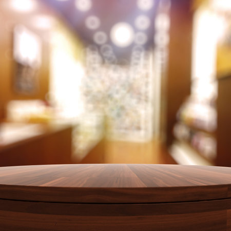 Empty wooden round table and blurred background for product presentation