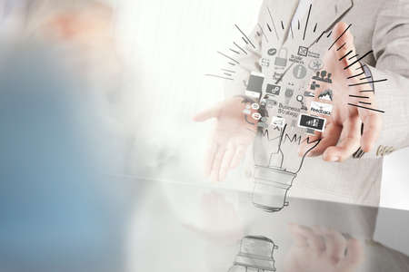 businessman hand showing creative business strategy with light bulb as conceptの写真素材
