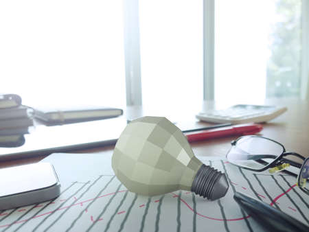 low polygonal 3d  light bulb on business work table concept symbolの写真素材