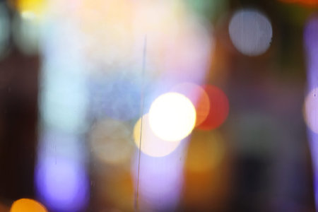 Abstract blurry bokeh reflected on glass background