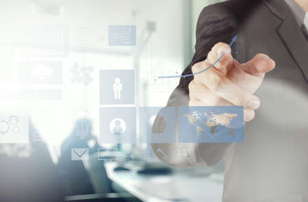 businessman hand working with new modern computer and business strategy as conceptの写真素材
