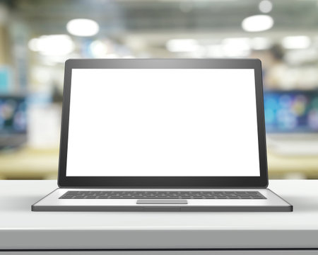 Laptop with blank screen on wood table and blurred background