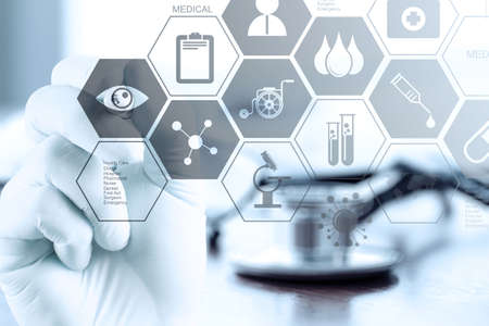 close up of Medicine doctor hand working with modern computer interface as medical conceptの写真素材