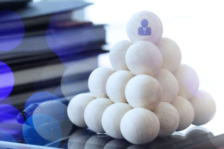 Leadership business concept,people icons on wooden balls on digital tablet computerの写真素材