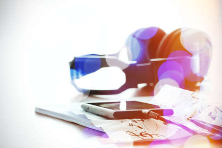 double exposure of abstract blurry bokeh with smartphone with headphone on musical notes paper with shallow DOF evenly matchedの写真素材