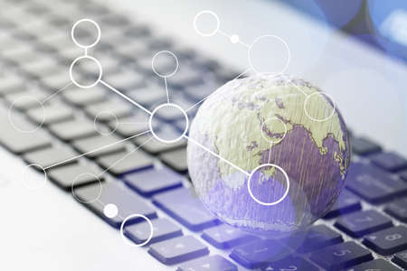 hand drawn texture globe with blank social media diagram on laptop computer as internet concept and bokeh exposureの写真素材
