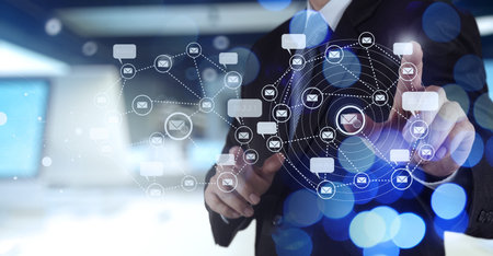 Double exposure of businessman shows modern technology as concept