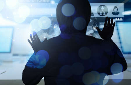 Double exposure of businessman working with new modern computer show social network structure and bokeh exposureの写真素材