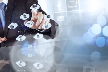 Double exposure of businessman shows modern technology as concept