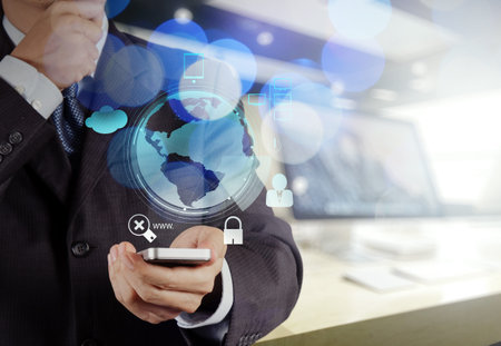 Double exposure of businessman shows modern technology as concept