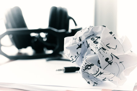 composing music concept with shallow DOF evenly matched crumpled musical notes paper