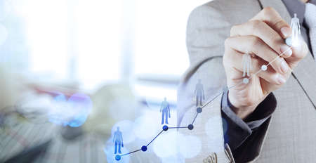 Double exposure of businessman hand choosing people icon as human resources concept Double exposure of businessman hand choosing people icon as human resources concept
