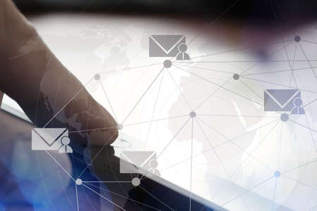 businessman finger use tablet computer with virtual email icon as conceptの写真素材