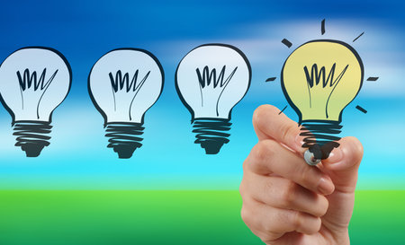 hand drawing creative business strategy with light bulb on blur nature background as conceptの写真素材