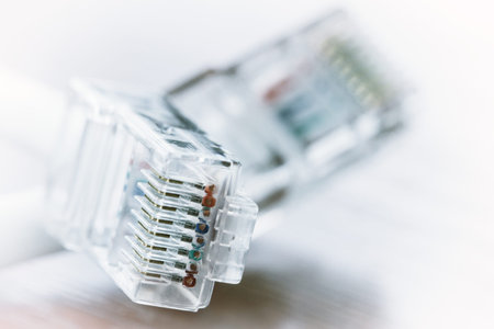 close up of RJ45 Plug Lan Network on wood desk