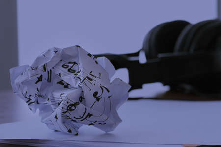 composing music concept with shallow DOF evenly matched crumpled musical notes paperの写真素材