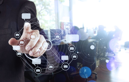 businessman hand use interactive computer with virtual email icon as concept