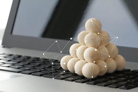 wooden texture ball stacking with social media diagram on laptop computer as internet concept