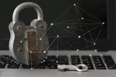 Internet security concept-old key and padlock on laptop computer keyboardの写真素材