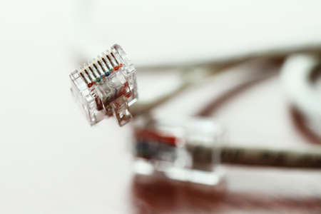 close up of RJ45 Plug Lan Network on wood deskの写真素材