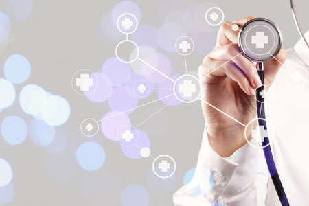 smart medical doctor hand showing network with bokeh exposure as medical network and media conceptの写真素材