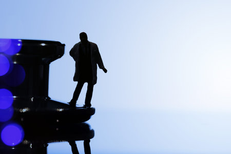 Modern medical concept- studio macro of miniature doctor with  a stethoscope and digital tablet  on wood table backgroundの写真素材