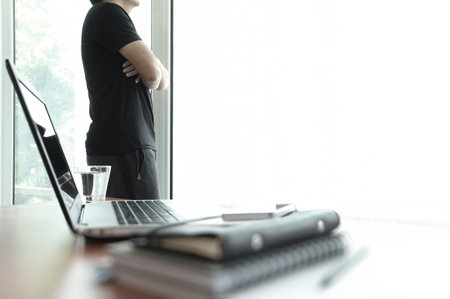 Young creative designer man working at office as concept