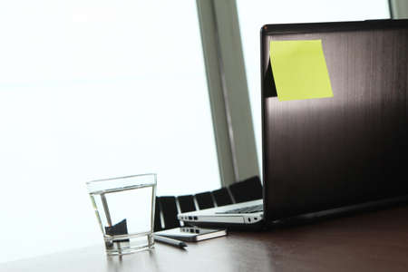 Office workplace with laptop and smartphone on wood tableの写真素材
