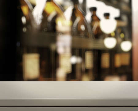 Empty table and blurred vintage bottle with bokeh background, product display showcaseの写真素材