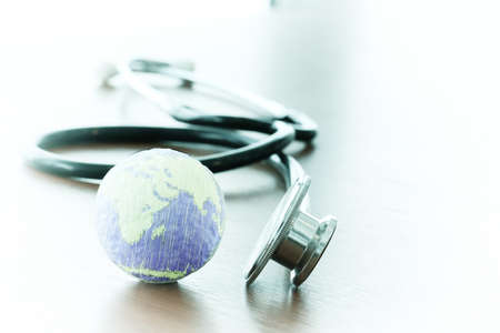 Studio macro of a stethoscope and texture globe with shallow DOF evenly matched abstract as medical network conceptの写真素材