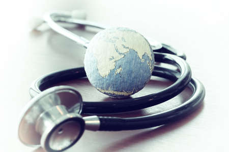 Studio macro of a stethoscope and texture globe with shallow DOF evenly matched abstract as medical network conceptの写真素材