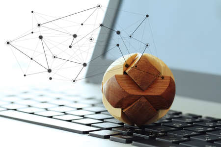wooden texture globe with social media diagram on laptop computer as internet conceptの写真素材