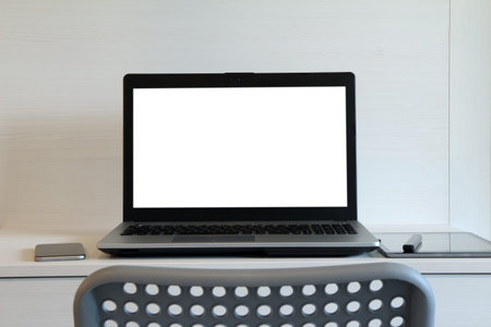 blank screen laptop computer is on twooden desk as workplace concept
