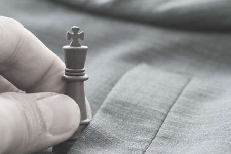 close up of chess figure on suit background strategy or leadership conceptの写真素材