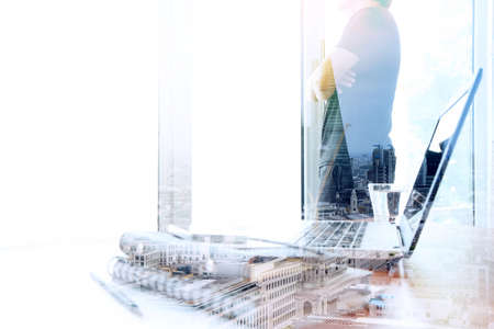 Double exposure of businessman working with new modern computer show social network structure as conceptの写真素材
