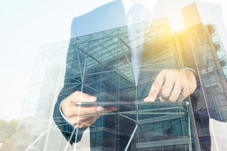 Double exposure of success businessman with abstract buildingの写真素材
