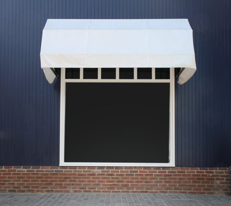 Shopfront vintage store front with canvas awnings and blank display
