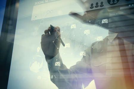Double exposure of businessman working with new modern computer show social network structure and bokeh exposureの写真素材