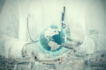 double exposure of smart medical doctor hand showing network with globe as medical network and media conceptの写真素材