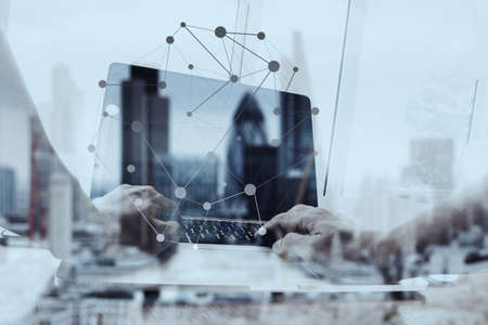 Double exposure of businessman working with new modern computer show social network structure and london city blurred background