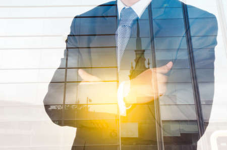 Double exposure of success businessman with abstract buildingの写真素材