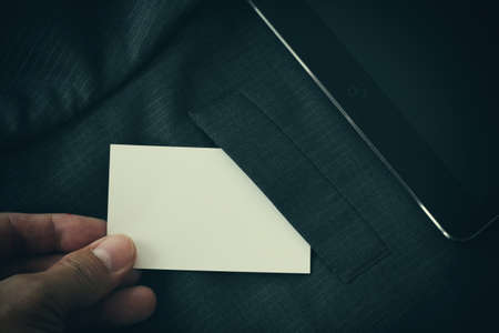 Blank corporate identity package business card with dark grey suit background.の写真素材