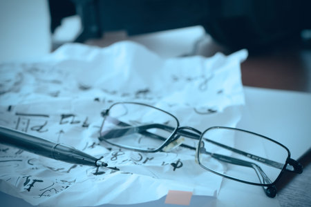 composing music concept with shallow DOF evenly matched jack of headphone and crumpled musical notes...