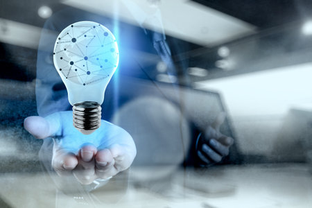 Double exposure of businessman working with new modern computer show ligh bulb with social network...