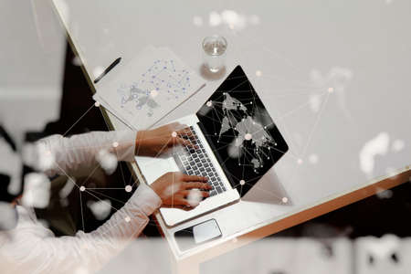 Double exposure of businessman hand working with new modern computer and business strategy as conceptの写真素材