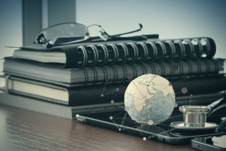 stethoscope and texture globe with digital tablet with social media network diagram as medical...