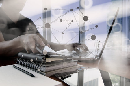 double exposure of businessman hand working with smart phone with laptop computer with social...