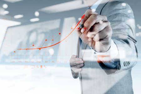 double exposure of businessman hand drawing virtual chart business on touch screen computer double exposure of businessman hand drawing virtual chart business on touch screen computer