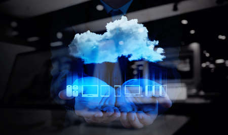 Businessman hand working with a Cloud Computing diagram on the new computer interface as concept Businessman hand working with a Cloud Computing diagram on the new computer interface as concept